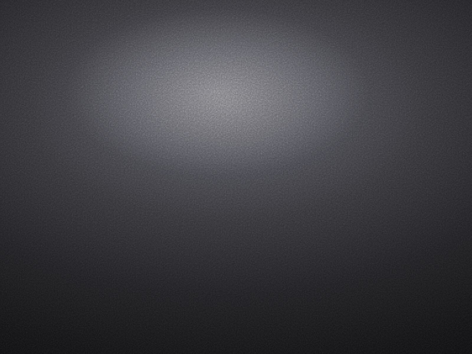 Gros plan sur la texture de grain feTurbulence appliquée en overlay dans une zone sombre